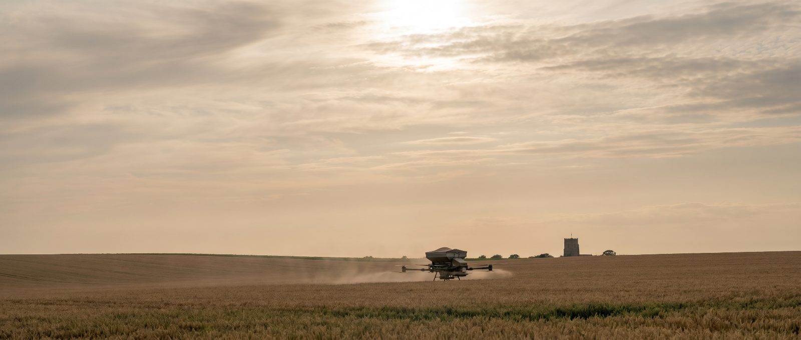Agricultural spray drone working over Essex farmland