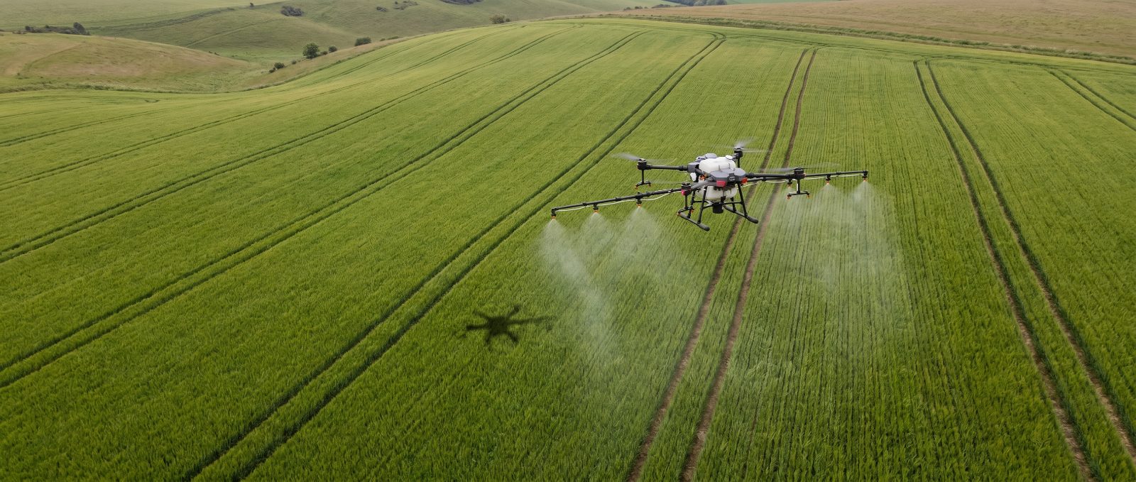 Agricultural spray drone working over Hampshire farmland