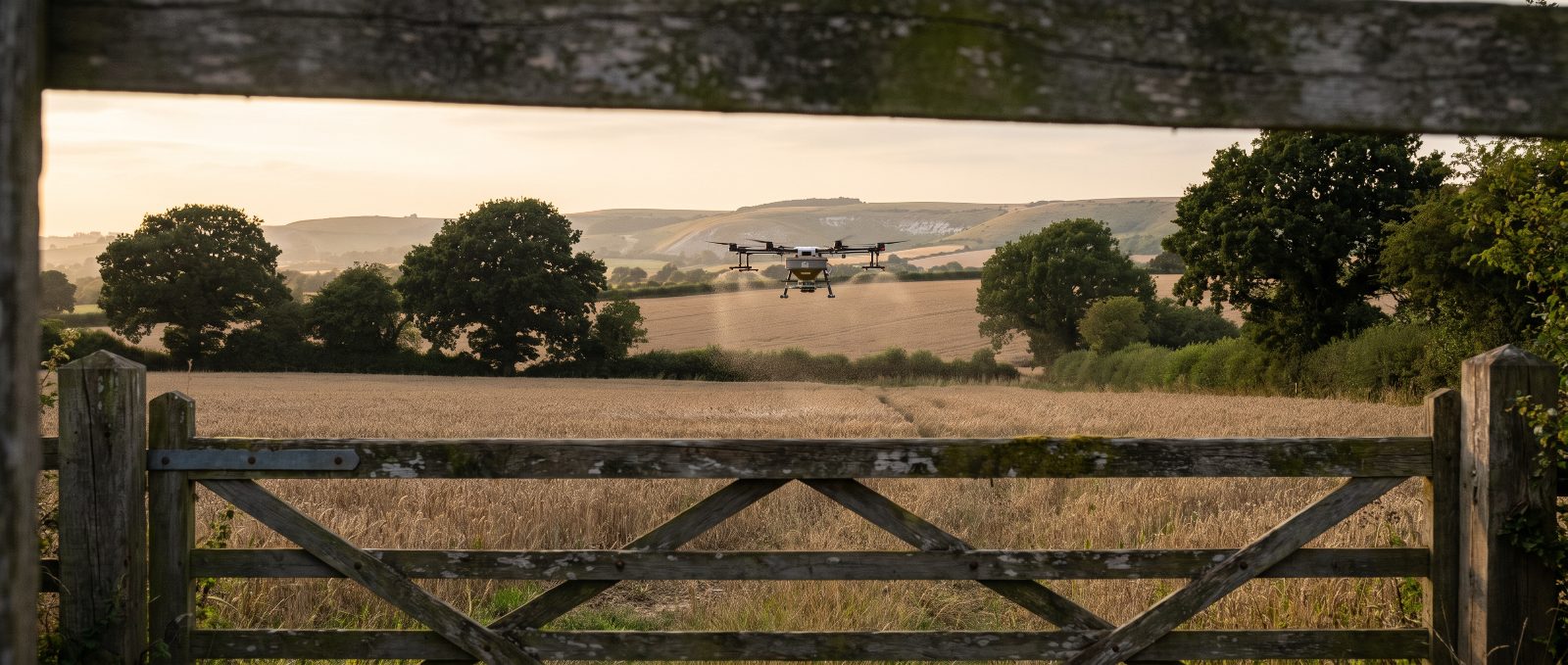 Agricultural spray drone working over South East farmland