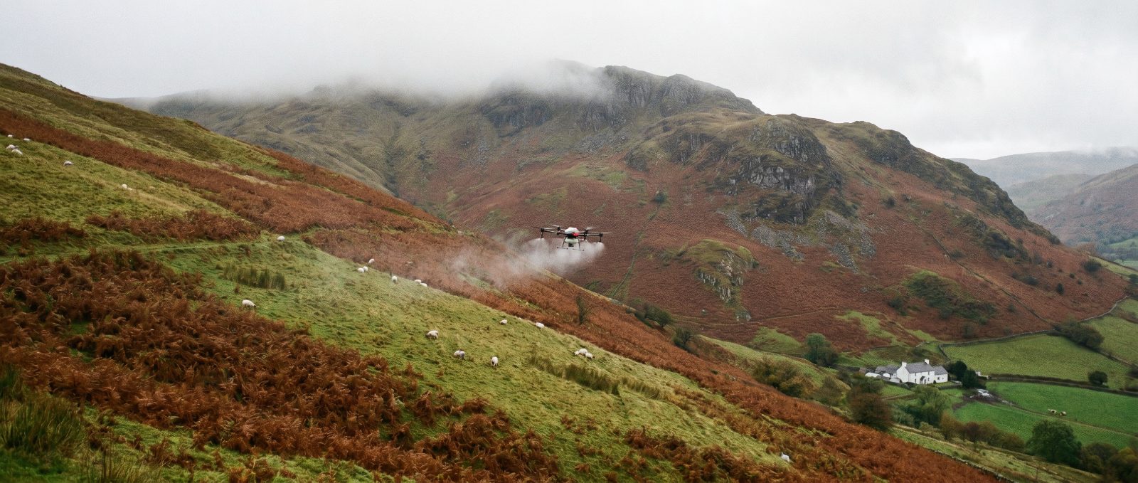 Agricultural spray drone working over Wales farmland