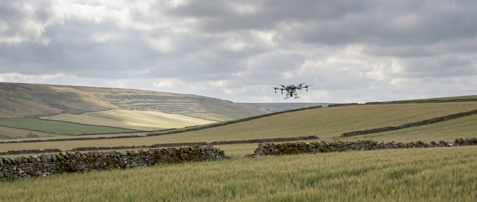 Agricultural spray drone working over Yorkshire farmland